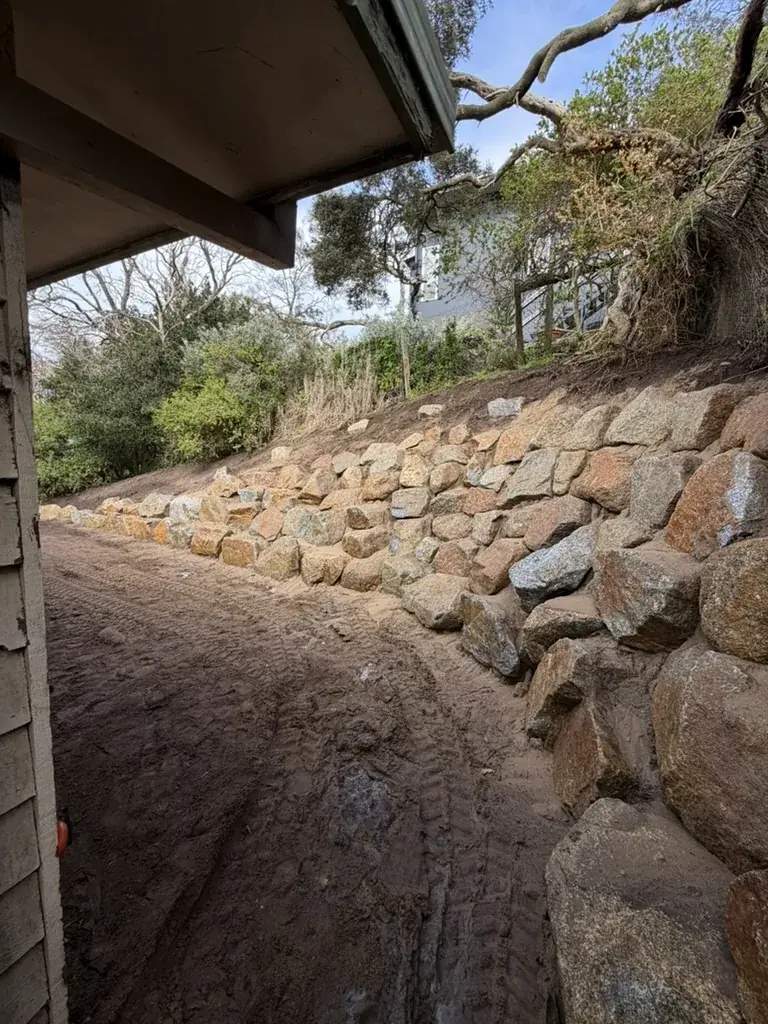 Natural rock retaining wall built by CEG
